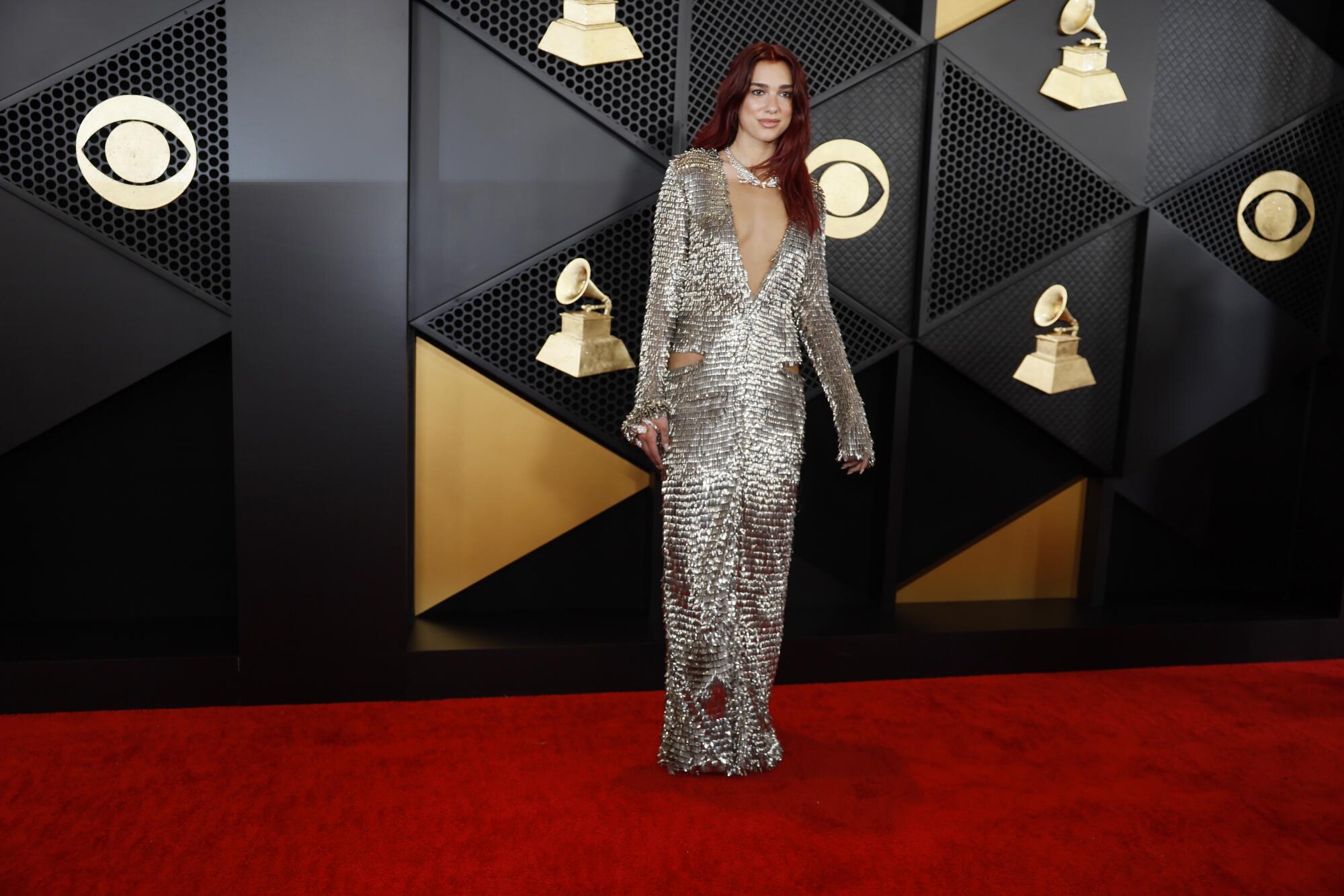 Dua Lipa arrives on the Grammys red carpet.