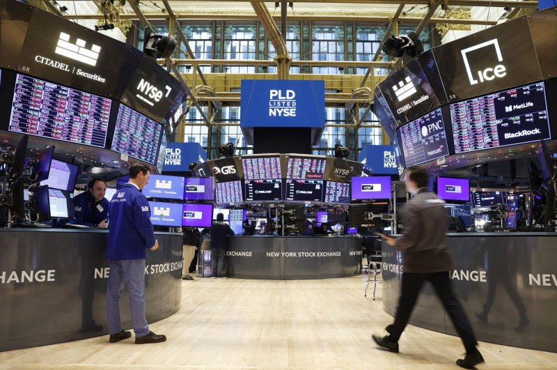 Traders work the floor of the New York Stock Exchange (NYSE) on Wall Street in New York City. On Tuesday, the Dow Jones Industrial Average dropped 525 points after the Consumer Price Index showed inflation ran hotter than expected in January. File Photo by John Angelillo/UPI