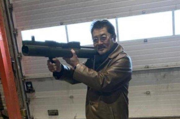 Takeshi Ebisawa holds a shoulder-fired rocket launcher shortly before being charged with attempting to buy weapons, including rocket launchers, from an undercover DEA agent in 2020. Photo courtesy of Justice Department