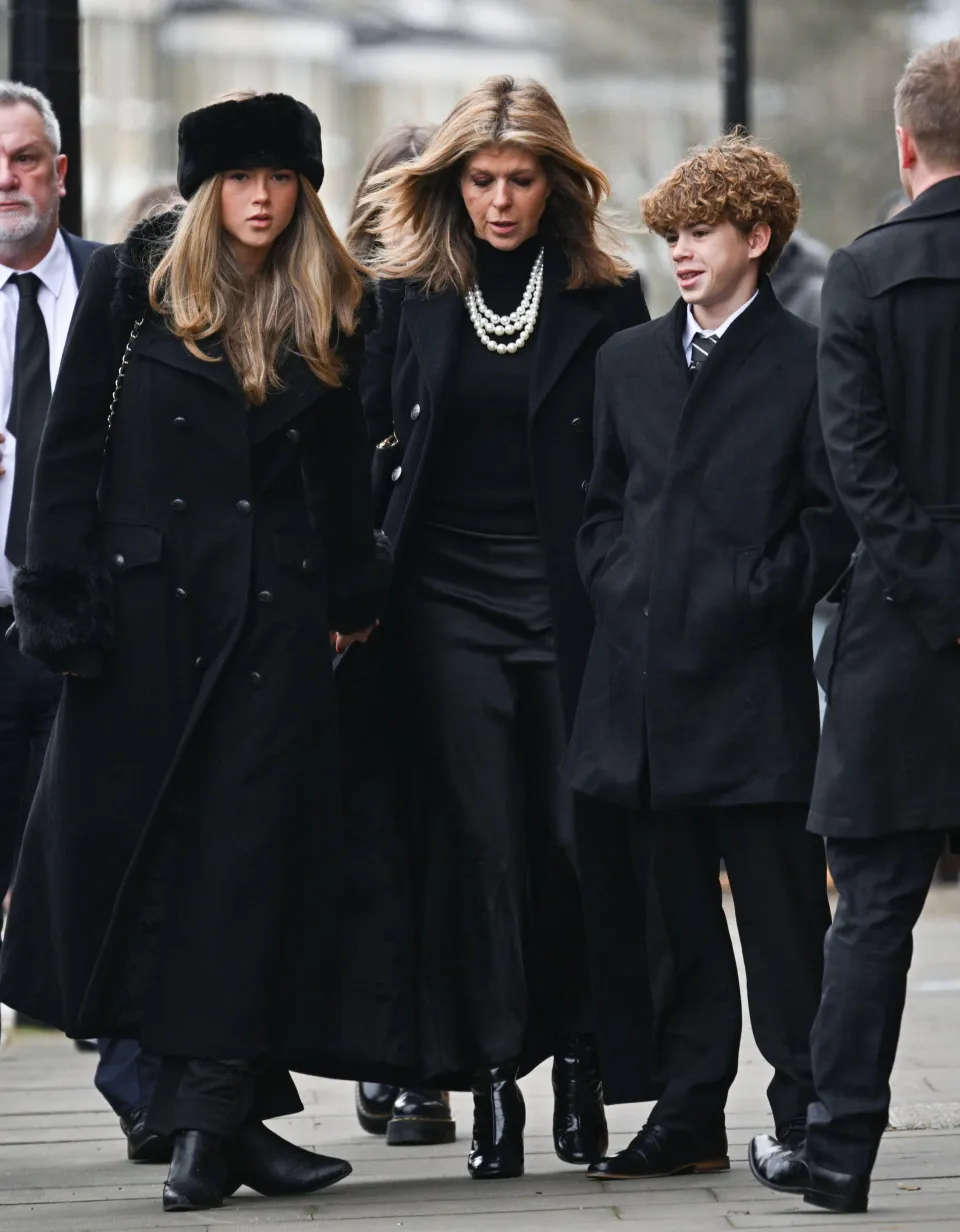 Kate, pictured with her children Darcey, 17, and Billy, 14, at her husband's funeral