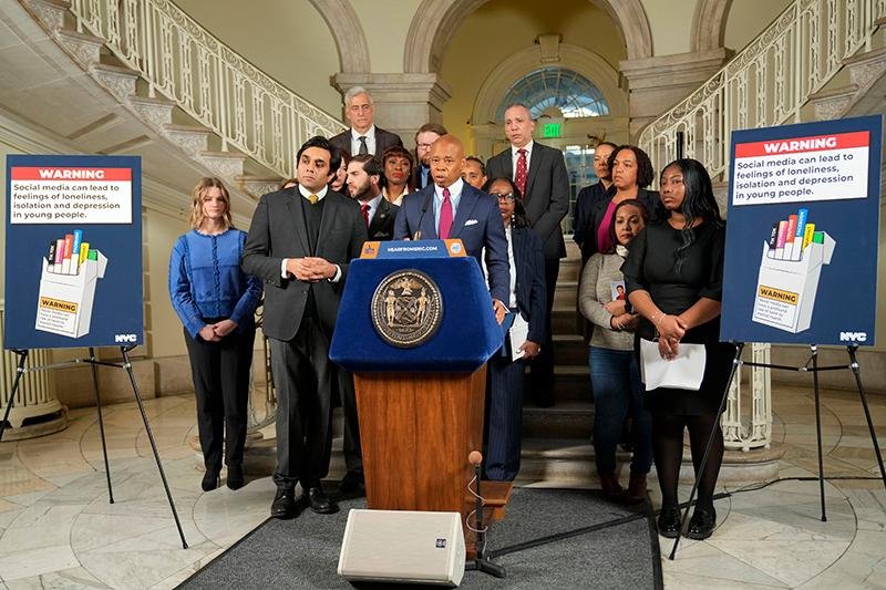 New York City Mayor Eric Adams (C) announced a lawsuit Wednesday that accuses five major social media platforms of fueling the ongoing national youth mental health crisis. Photo courtesy of New York City/Release