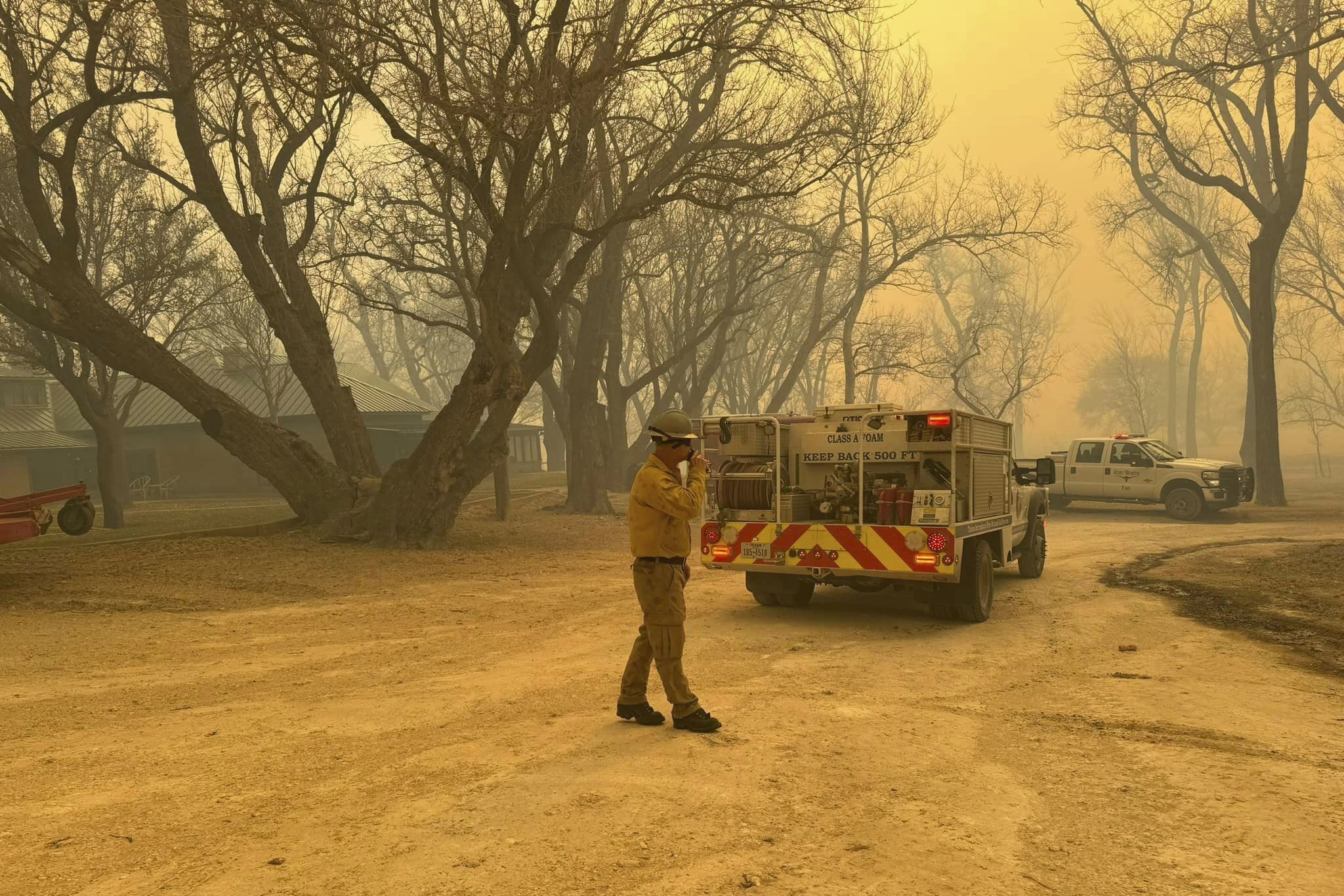 Texas firefighters work to tackle the huge blaze on Tuesday