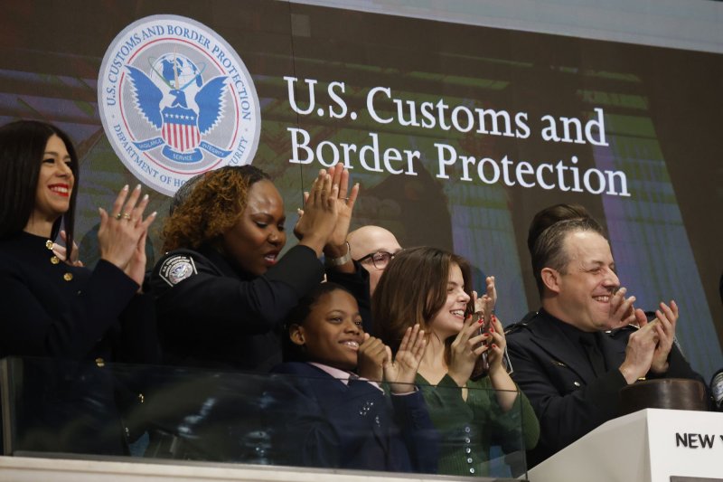 Representatives of U.S. Customs and Border Patrol Protection ring the opening bell on the floor of the New York Stock Exchange (NYSE) on the first trading day of 2024 on Wall Street in New York City on Jan. 2. Senators Sunday announced details of a border aid package to be considered this week. Firl Photo by John Angelillo/UPI