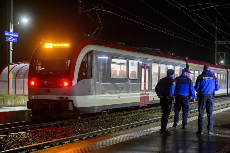 Swiss police Thursday night killed an axe-wielding hostage-taker from Iran and freed 15 train passengers unharmed at the Essert-sous-Champvent station. Photo Laurent Gillieron/EPA-EFE