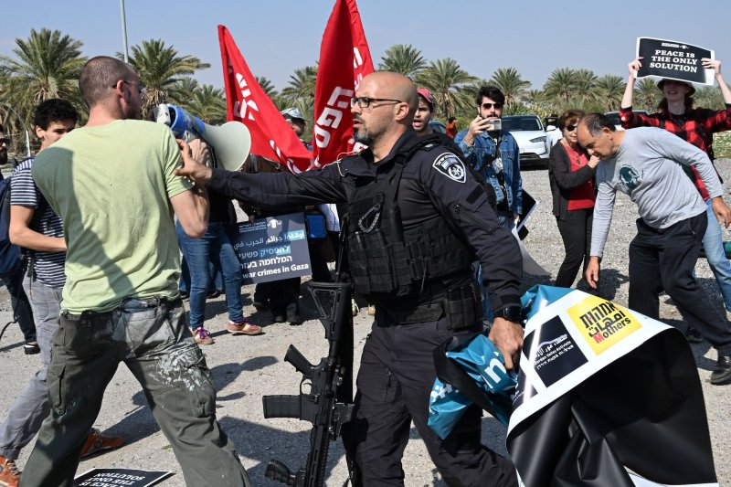 Israeli security forces push a man at a protest of Israelis and Palestinians who were calling for a cease-fire and an end of the war in Gaza at the Almog Junction, south Jordan Valley near Jericho, West Bank, on Friday. Texas A&amp;M University on Friday said it plans to shut down its Qatar campus over the next four years due to unrest in the region. Photo by Debbie Hill/UPI