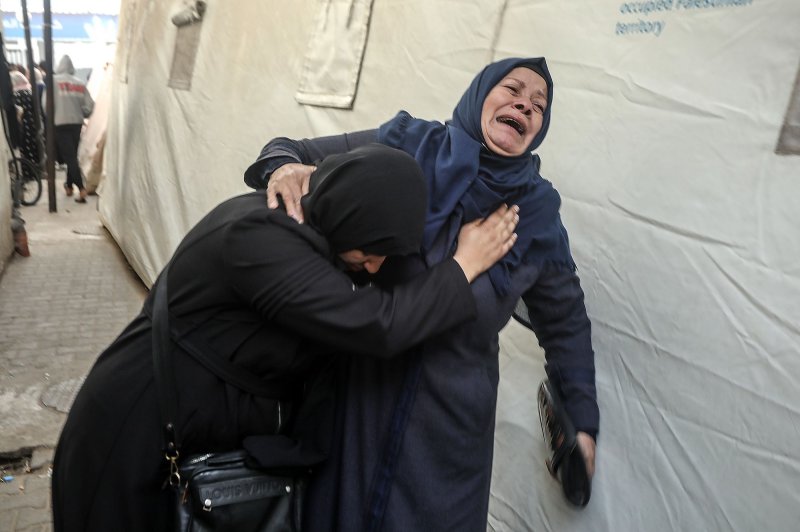 Palestinians mourn after identifying the bodies of relatives killed in overnight Israeli bombardment on the southern Gaza Strip, at Al-Najjar hospital in Rafah, on Saturday, February 10, 2024. Photo by Ismael Mohamad/UPI