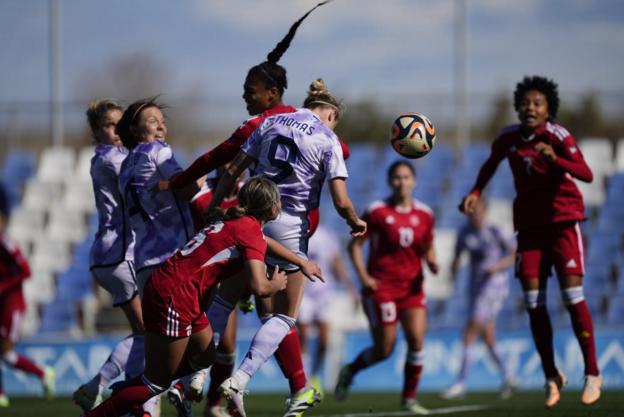 Martha Thomas heading home her second goal against Philippines for Scotland