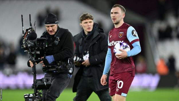 Jarrod Bowen walks with the match ball after West Ham's win against Brentford