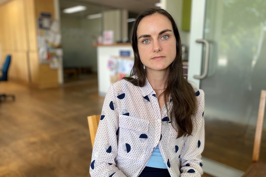 A young professional woman looking stern.