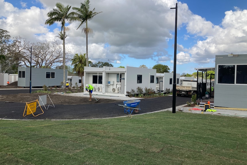 Newly built pods, surrounded by new roads and landscaping.