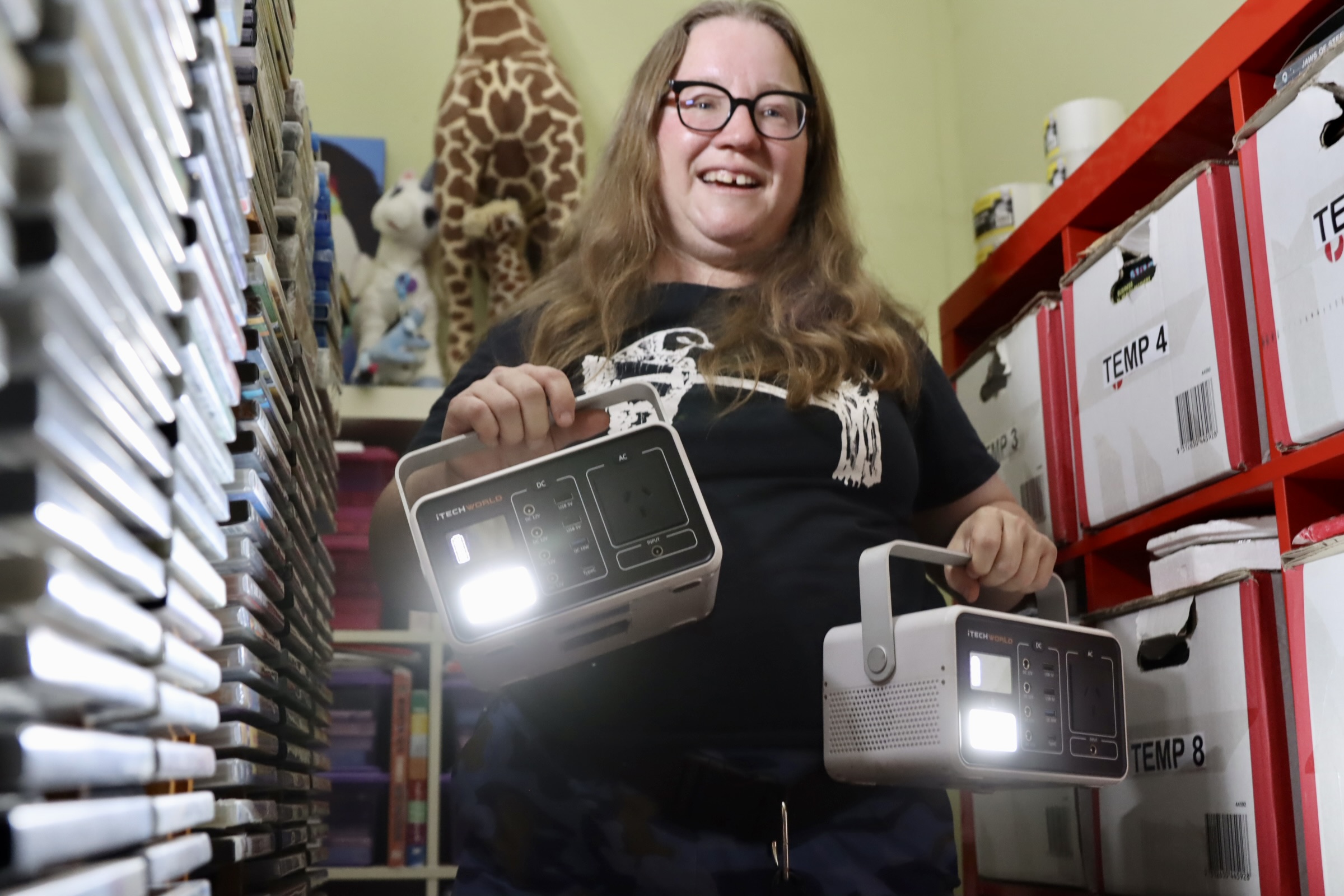 woman holding portable power stations.