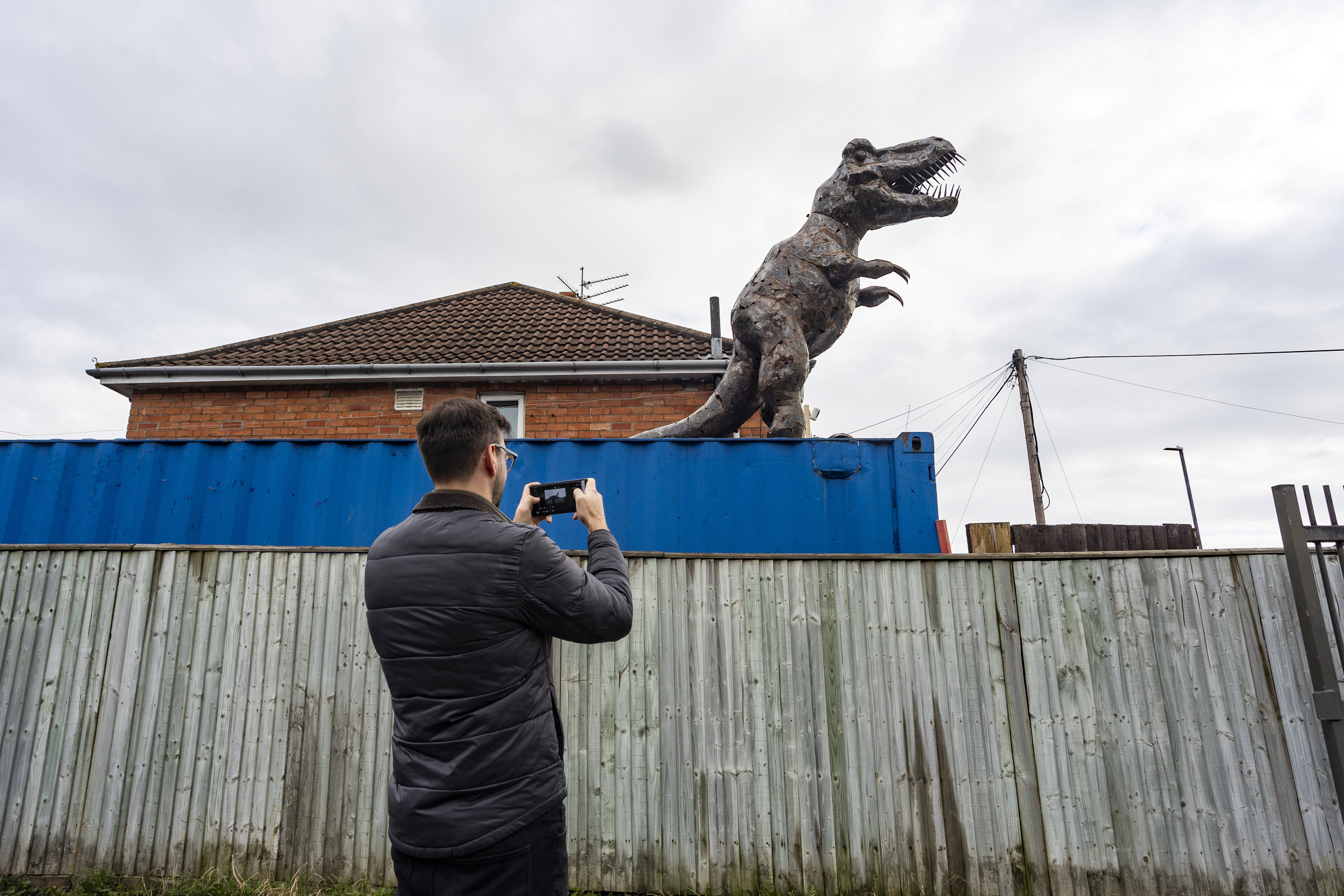 One local snaps the dino sculpture