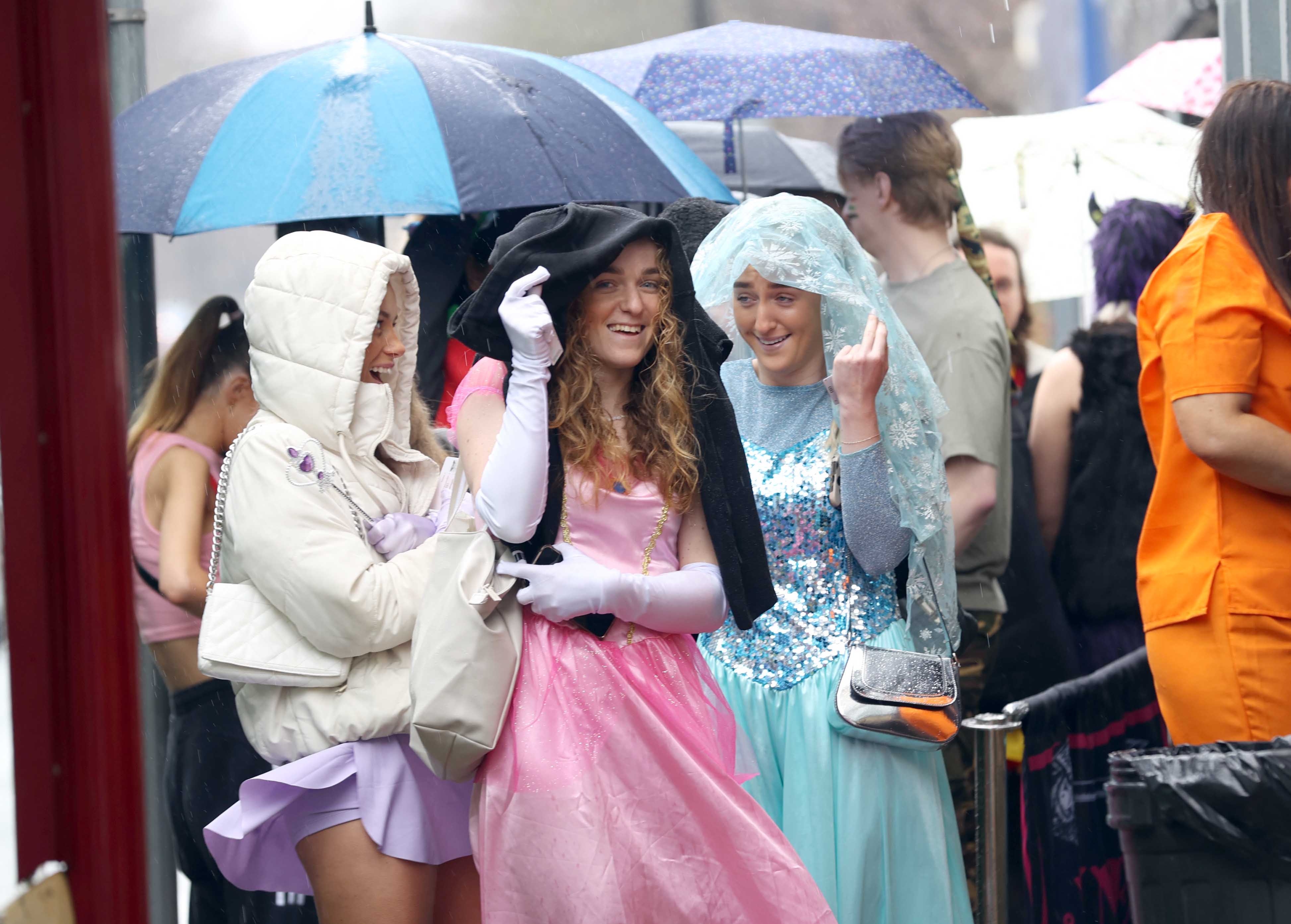 Drinkers dressed as princesses covered themselves with hoods and parts of their outfits