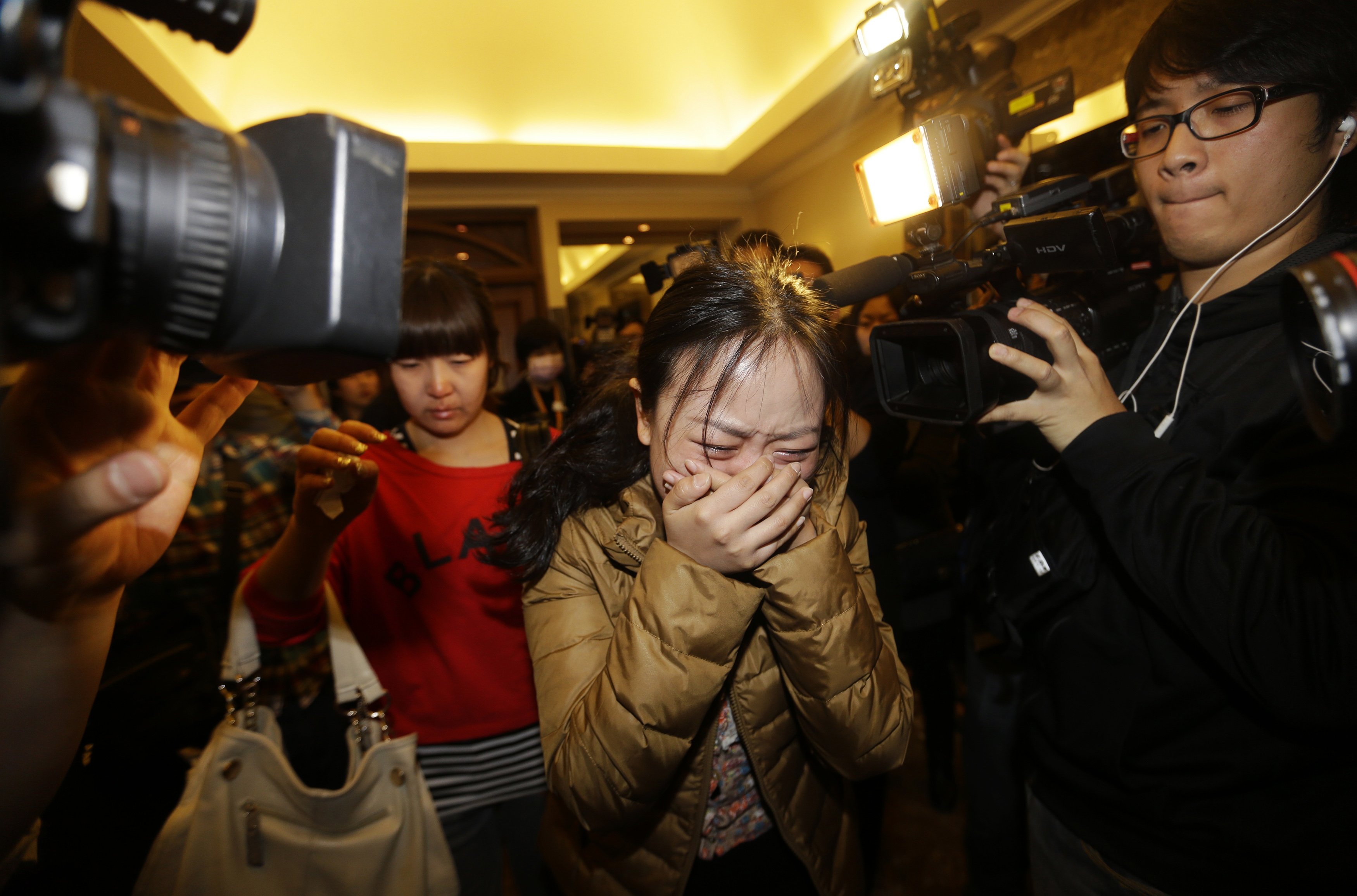 A relative of a passenger cries as at a hotel in Beijing on March 9, 2014