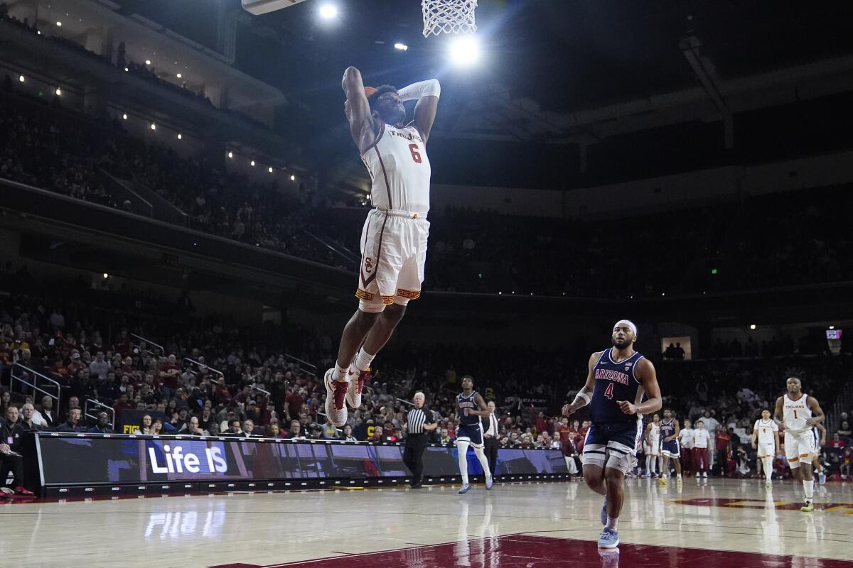 USC guard Bronny James scores on a fastbreak dunk during the first half against Arizona on Saturday.