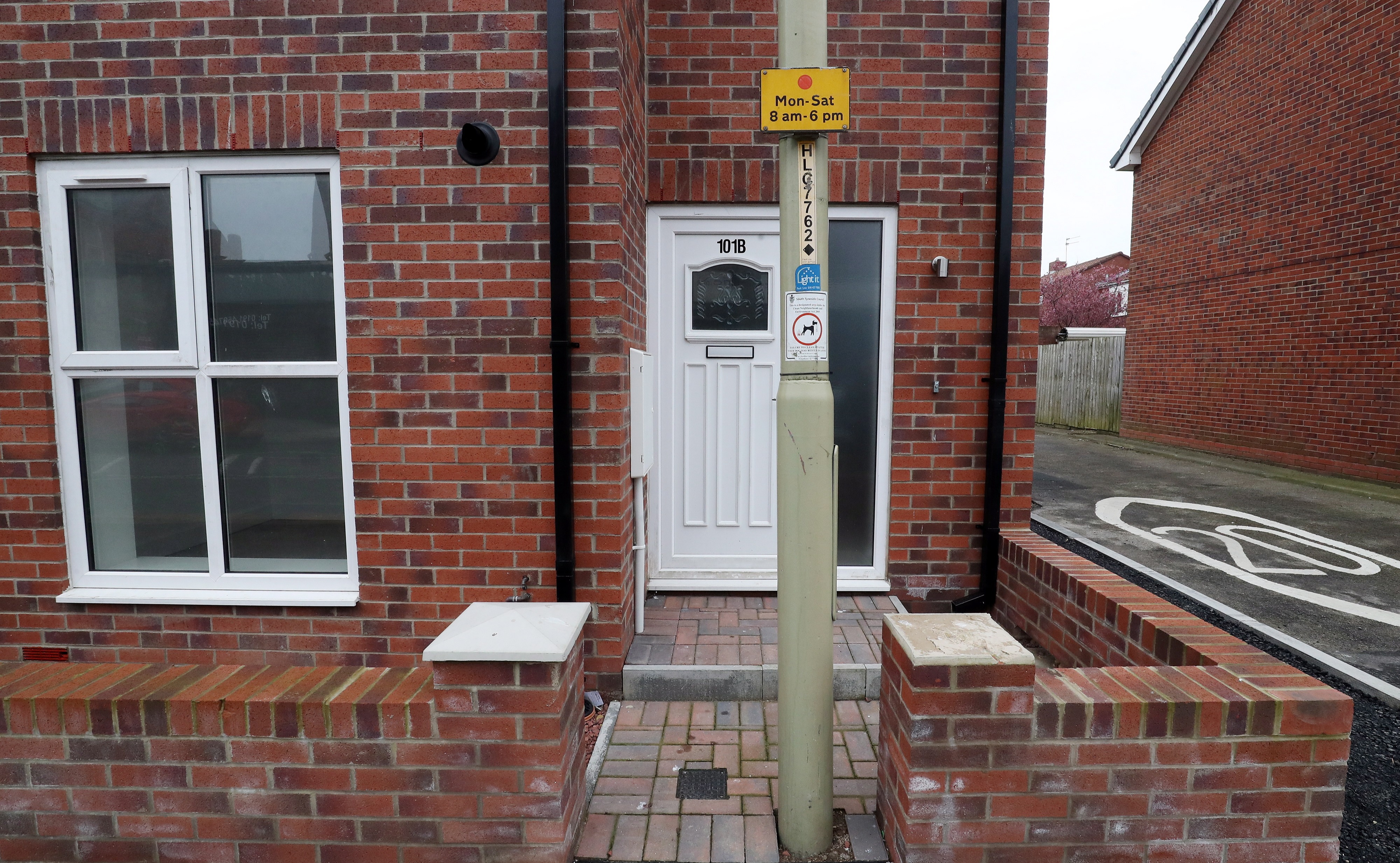 A lamppost blocks one of the front doors