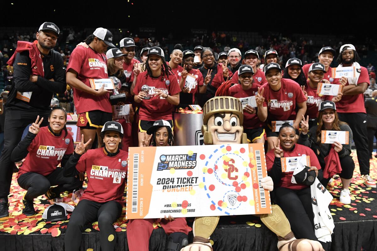 USC players celebrate after defeating Stanford in the women's Pac-12 championship game on Sunday.