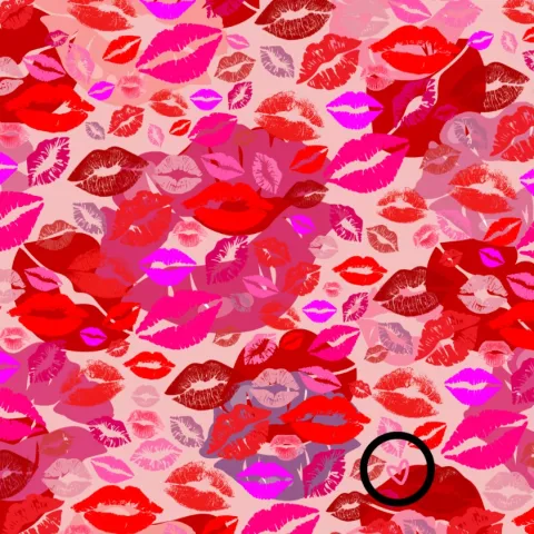 The small pink heart disguised among the lipstick kisses can barely be seen in the bottom right corner of the image