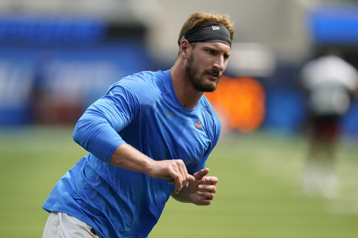 Chargers edge rusher Joey Bosa warms up before a preseason NFL football game.