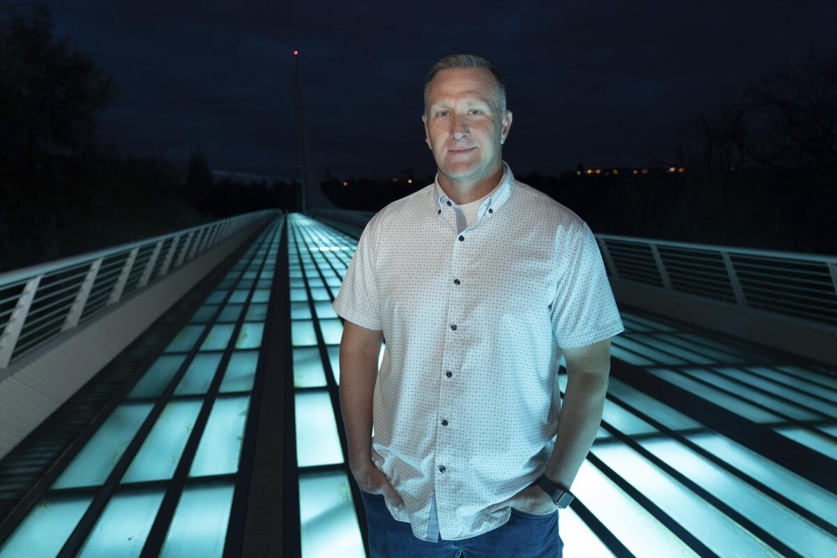 Shasta County Supervisor Kevin Crye poses on a Redding bridge.  