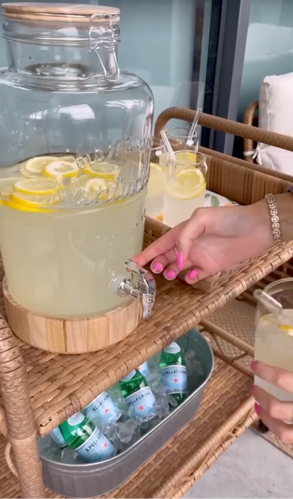 She stocked the bar cart with glasses, trays, ice, and sparkling water