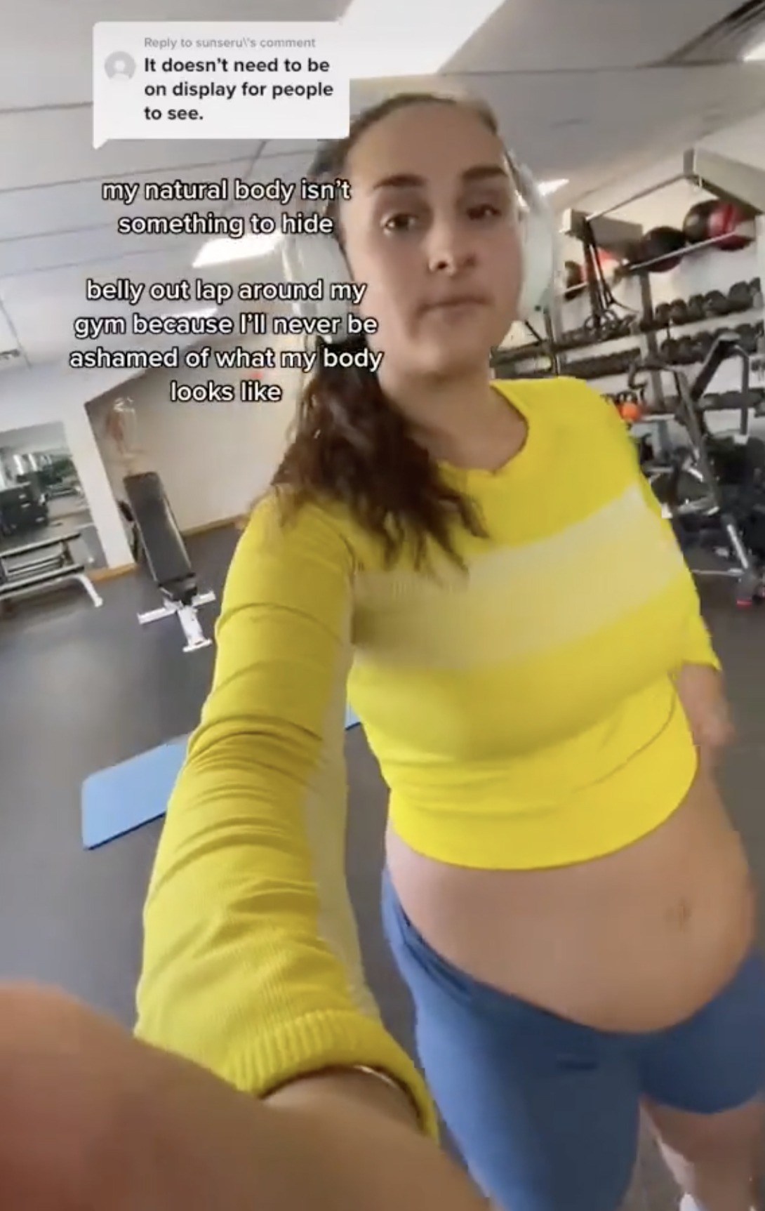 She took a lap around her gym with her tummy out