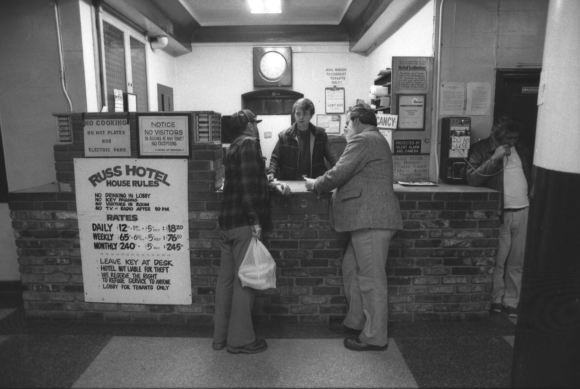 Homeless advocate Andy Raubeson at the front desk of the Russ Hotel in Los Angeles in 1985.