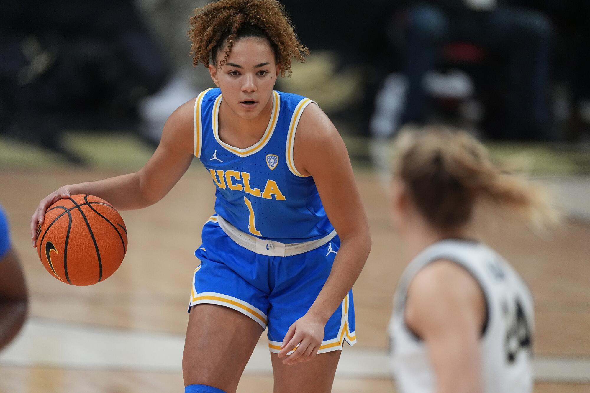 UCLA guard Kiki Rice controls the ball against Colorado in January.