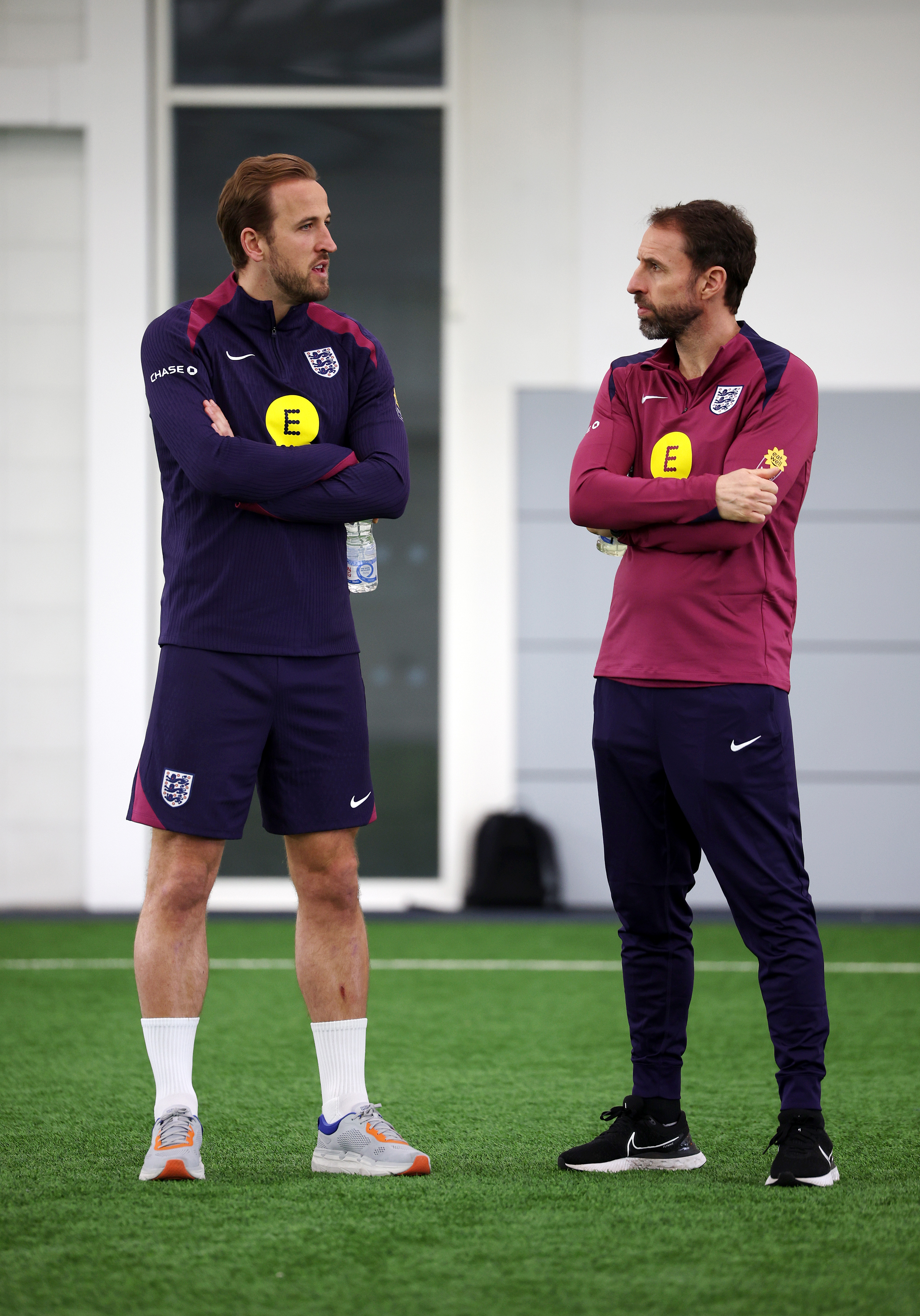 Skipper Harry Kane, here chatting with manager Gareth Southgate, could have been surpassed as England's key player by Bellingham