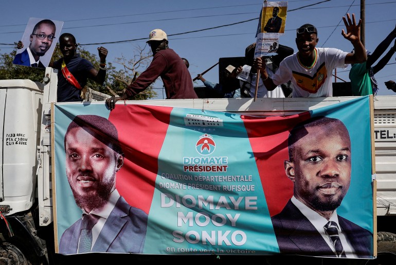 FILE PHOTO: A supporter of jailed Senegalese opposition leader Ousmane Sonko reacts during an electoral campaign caravan to support the detained presidential election candidate Bassirou Diomaye Faye, who Sonko picked to replace him in the race, in the outskirts of Dakar, Senegal March 12, 2024. REUTERS/Zohra Bensemra/File Photo