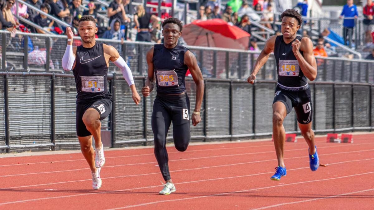 Demare Dezeurn (middle) wins the 60-meter dash at the 2024 California Winter Track & Field Championships.