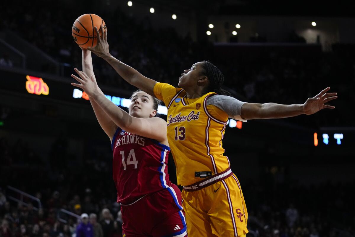 Kansas center Danai Papadopoulou tries to shoot over USC center Rayah Marshall.