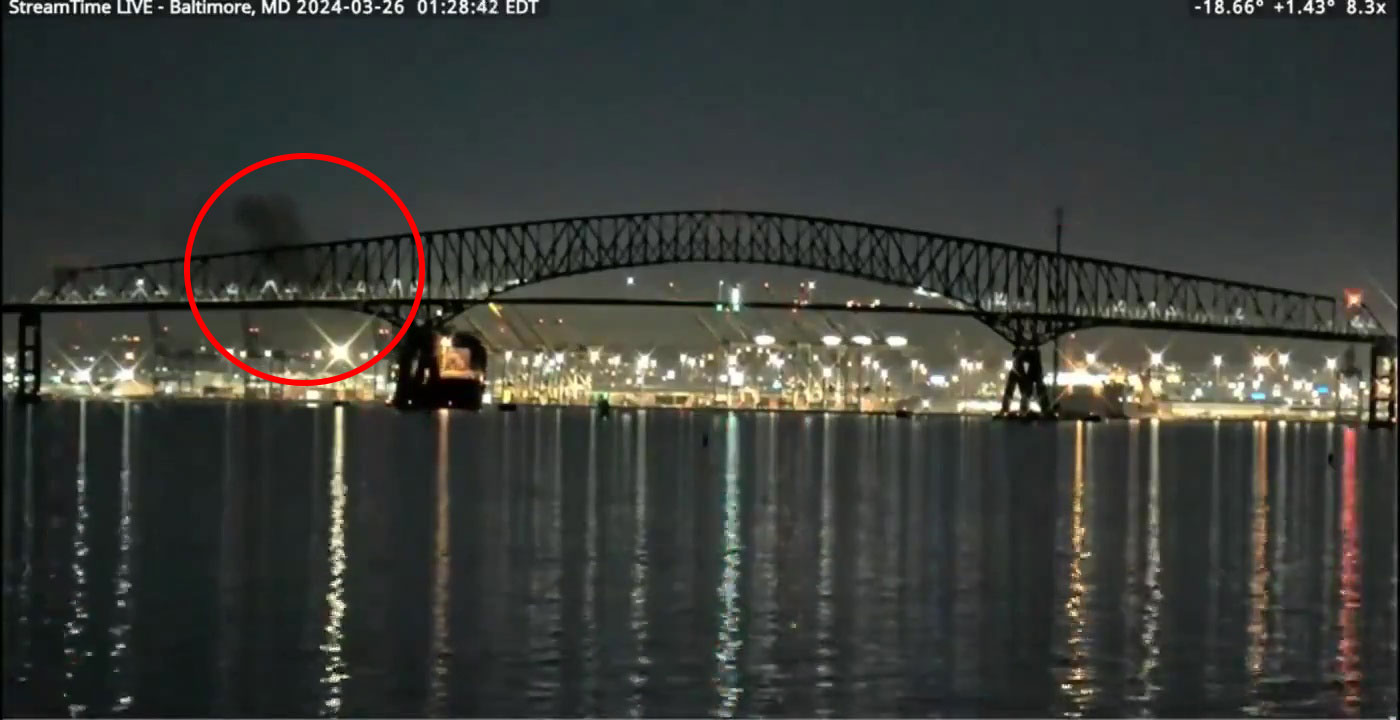 Smoke could be seen billowing from the vessel as it slowly turned and headed into the bridge's support beam