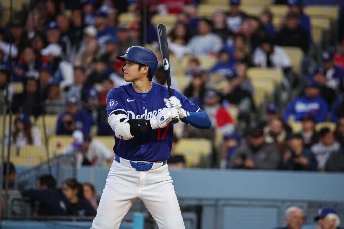 Shohei Ohtani bats during the Dodgers' spring training game against the Angels at Dodger Stadium on Monday.