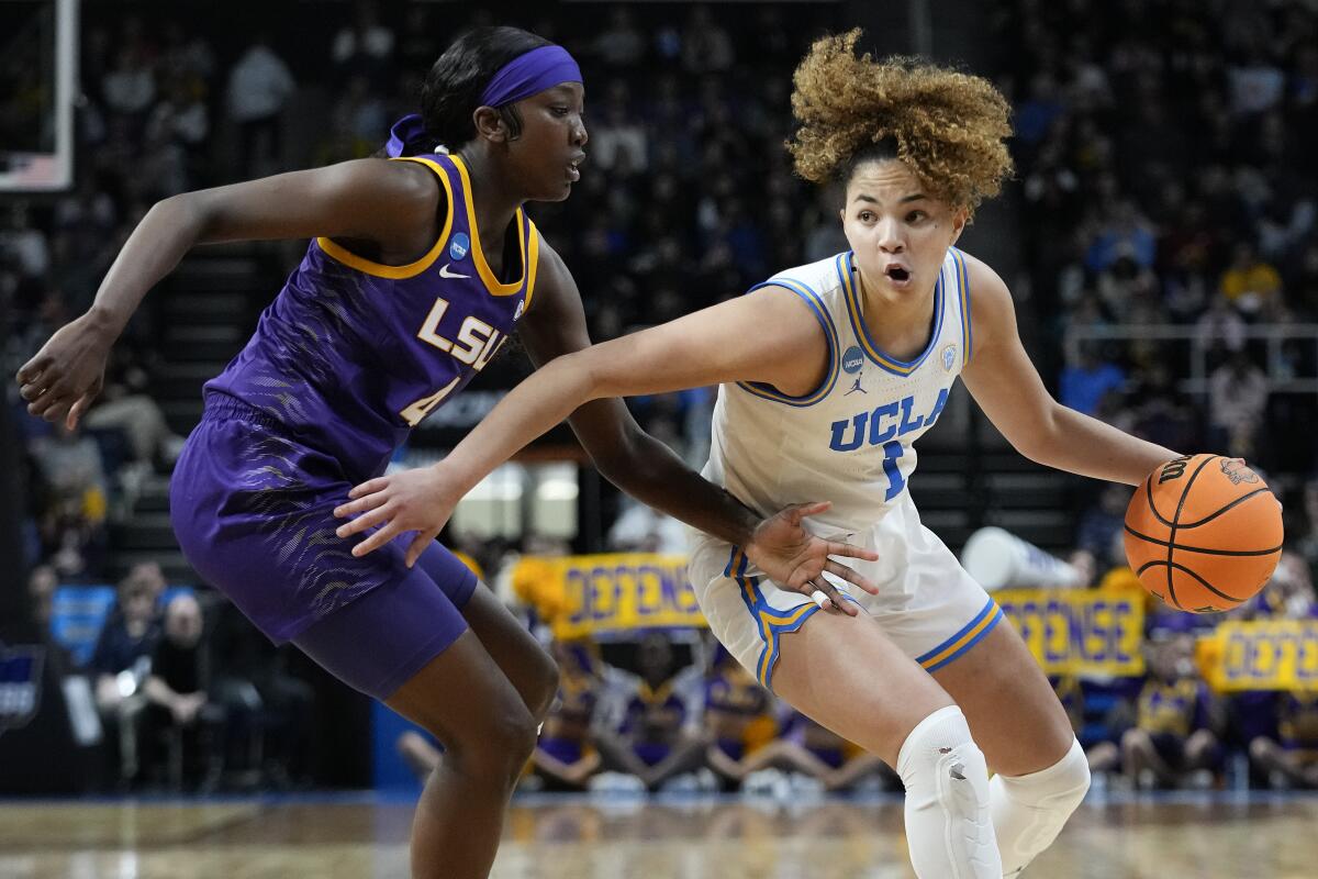 UCLA guard Kiki Rice drives against LSU guard Flau'jae Johnson during the third quarter of their Sweet 16 game Satuday.