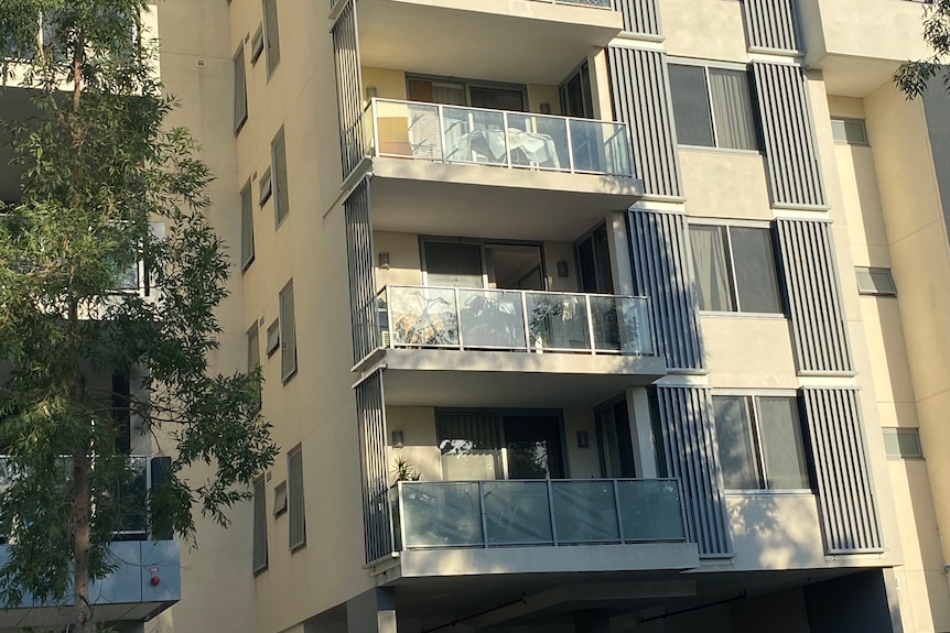 A series of apartments on the side of a building.