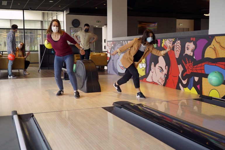 LDLC computer hardware retailer office staff play bowling at the company headquarters in Limonest near Lyon, France, March 10, 2022. Picture taken March 10, 2022. REUTERS/Lucien Libert