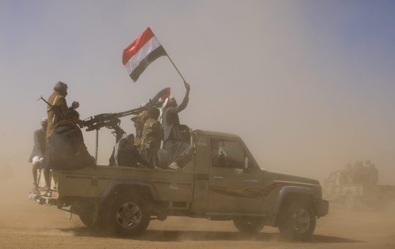 A pick-up truck carrying tribal supporters of the Houthi group parade during a protest against recent U.S.-led strikes on Houthi targets