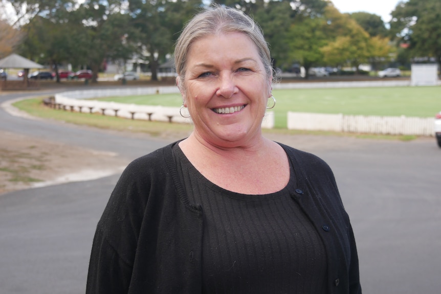 A woman wearing a black shirt. 