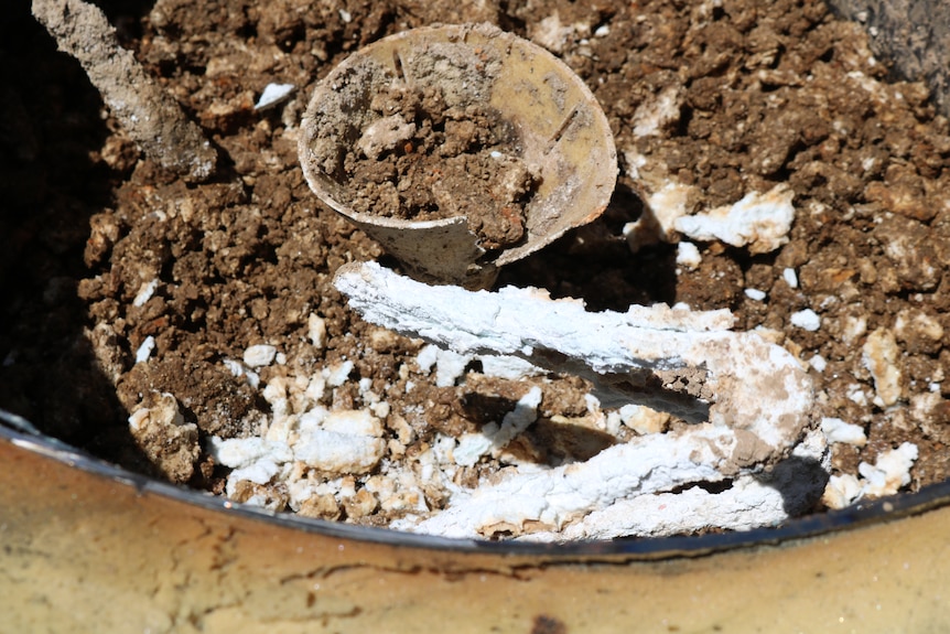 Corroded hot water system with dirt.