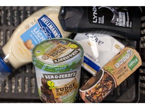 A selection of consumer healthcare and food products, manufactured by Unilever Plc, in a shopping basket at a convenience store arranged near Guildford, UK, on Monday, Feb. 5, 2024. Unilever are due to release their full year earnings on Thursday, Feb. 8.