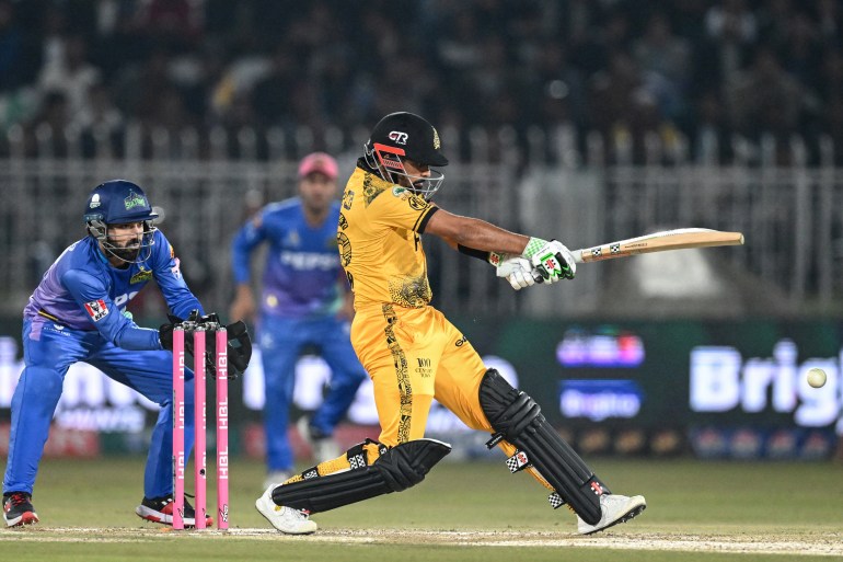 Peshawar Zalmi's captain Babar Azam (R) plays a shot during the Pakistan Super League (PSL) Twenty20 cricket match between Mulatan Sultans and Peshawar Zalmi at the Rawalpindi Cricket Stadium in Rawalpindi on March 5, 2024. (Photo by Aamir QURESHI / AFP)