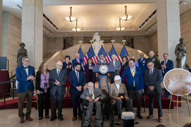 Lawmakers participate in the Congressional Gold Medal presentation ceremony Thursday honoring the 23rd Headquarters Special Troops and the 3133rd Signal Services Company, known collectively as the Ghost Army, who used inflatable tanks, sound effects,and other fake equipment to lure the German Army away from Allied troops in World War II. Photo by Bonnie Cash/UPI