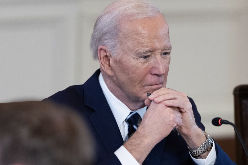 President Joe Biden listens in during a meeting in the East Room of the White House on Tuesday. He will talk about his new infrastructure program on Wednesday in Milwaukee. Photo by Tom Brenner/UPI