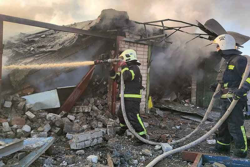 Firefighters in Mykolaiv fight fires following a Russian missile strike on New Year's Eve 2022. The city and surrounding areas came under renewed attack overnight from waves of attack drones launched from Russian warships in the Black Sea that also targeted the neighboring Odesa region, knocking out power. File Photo by Zaporizhia Region Administration/UPI