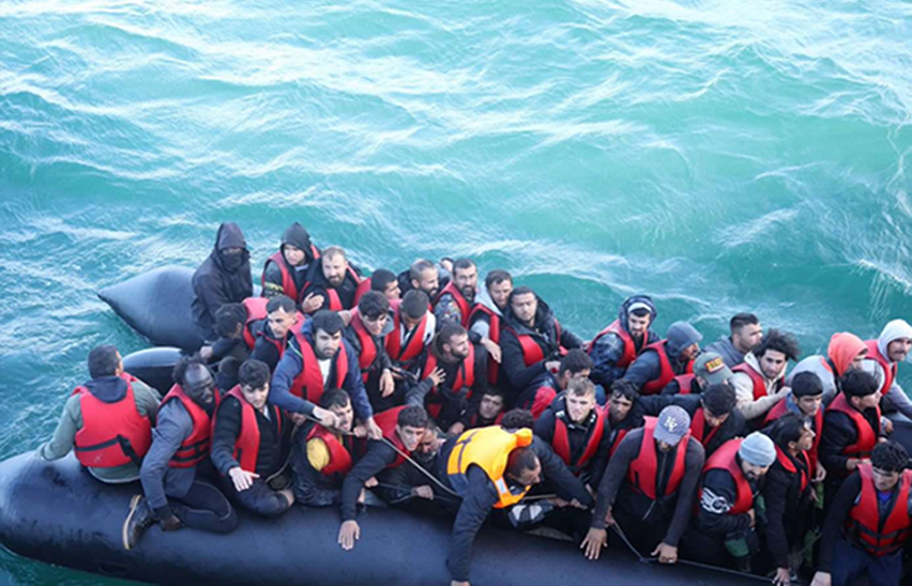 Choul Phan Maker, top left, pictured steering an overcrowded dinghy heading to British shores last August