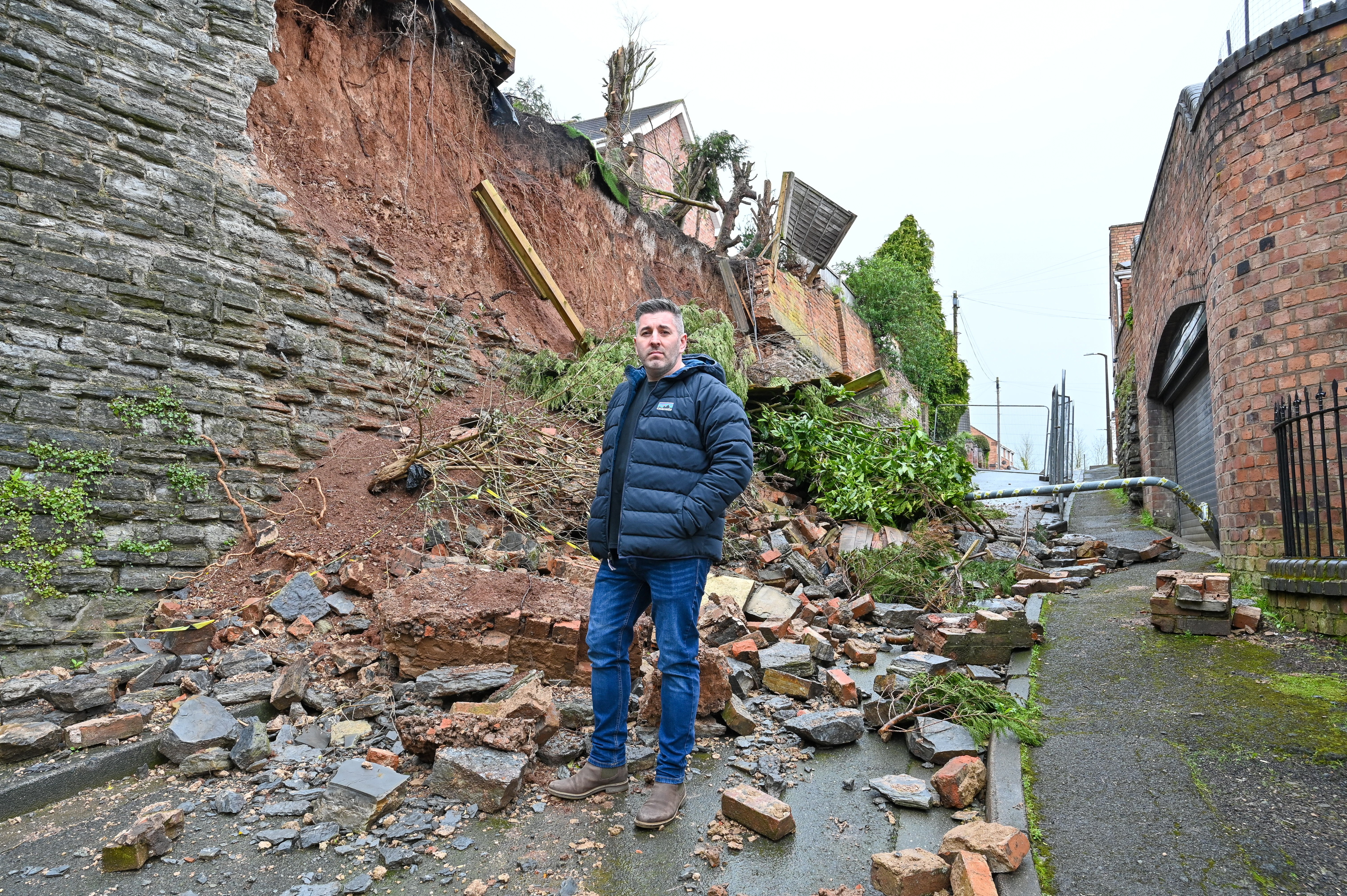 Dad Adam Giagnotti says he may have to fork out £400,000 to repair an ancient wall that collapsed below his home