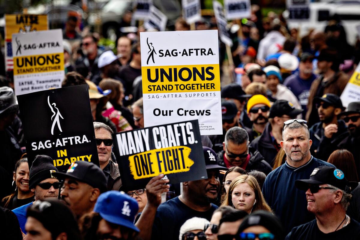 Hollywood crew members union IATSE rally at Woodley Park to kick off their contract negotiations with the major studios.