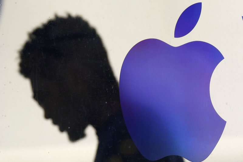 The Apple logo hangs outside of an Apple retail store in SoHo in New York City on Thursday. The U.S. Justice Department said it has joined with 16 other state and district attorneys general in filing a civil antitrust lawsuit against Apple for violating the Sherman Act with its monopolization of the smartphone market. Photo by John Angelillo/UPI