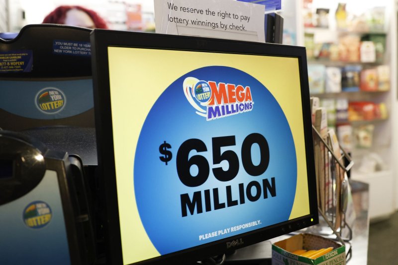 An NYC store display announces the news that the Mega Millions jackpot for Tuesday night's drawing has reached $650 million. Photo by John Angelillo/UPI